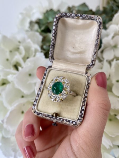 Cabochon Emerald and Diamond Cluster Ring in Platinum; 3.62ct cabochon-cut emerald with no oil within an oval white diamond and yellow sapphire surround