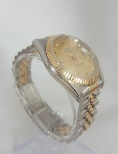 Rolex Datejust Steel and Gold 36mm Automatic with Original Diamond Dial and Box; with champagne dial, factory-set diamond hour markers, a magnified date aperture at the 3 o'clock position, screw-locked crown and quick set date, steel and gold Jubilee bracelet
