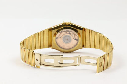 Omega Constellation 18ct Yellow Gold 35mm Chronometer Automatic, gold colour dial, date indicator, yellow gold fixed bezel, black Roman numerals, skeleton back, 18ct yellow gold bracelet with matching 18ct push-button clasp