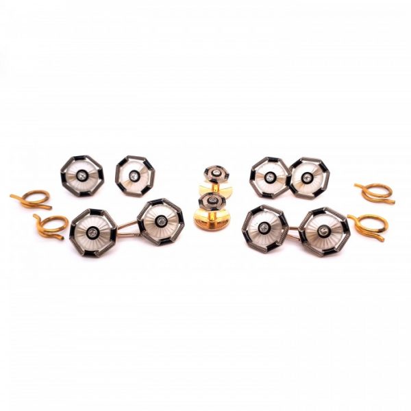 Antique Edwardian Old Cut Diamond, Rock Crystal, Onyx and Enamel Dress Set in platinum and gold; consisting of four buttons with separate split rings, a pair of cufflinks with white gold carabiner links and a pair of shirt studs, with screw fittings. Circa 1910. Stamped 18, with invoice number 176/10. Comes in an original Finnigans of New Bonds Street fitted case