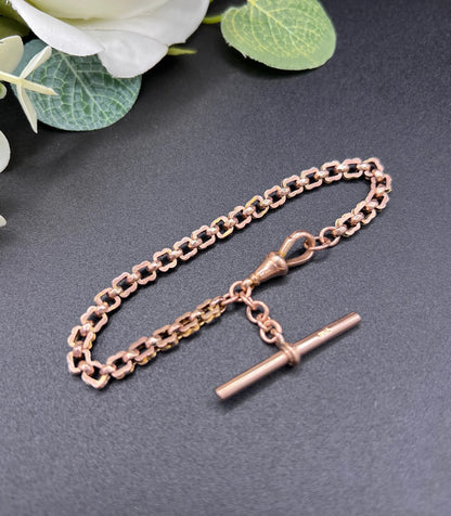 A fancy link rose gold bracelet with a T-bar and dog clip clasp