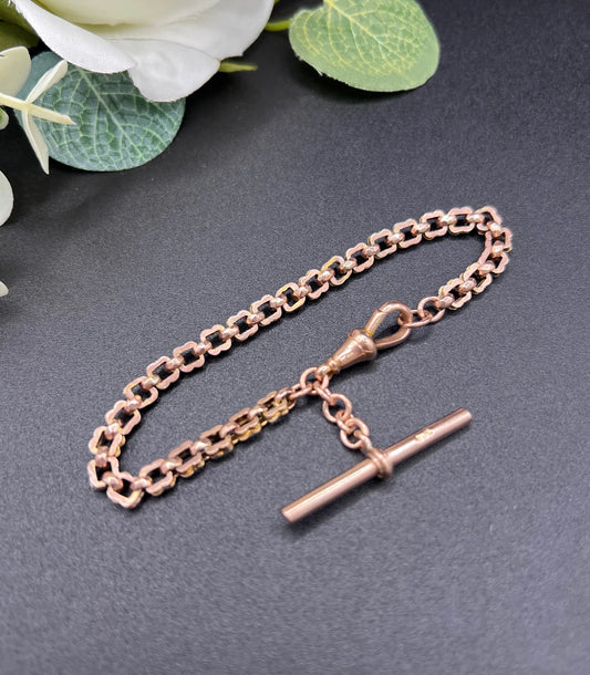 A fancy link rose gold bracelet with a T-bar and dog clip clasp