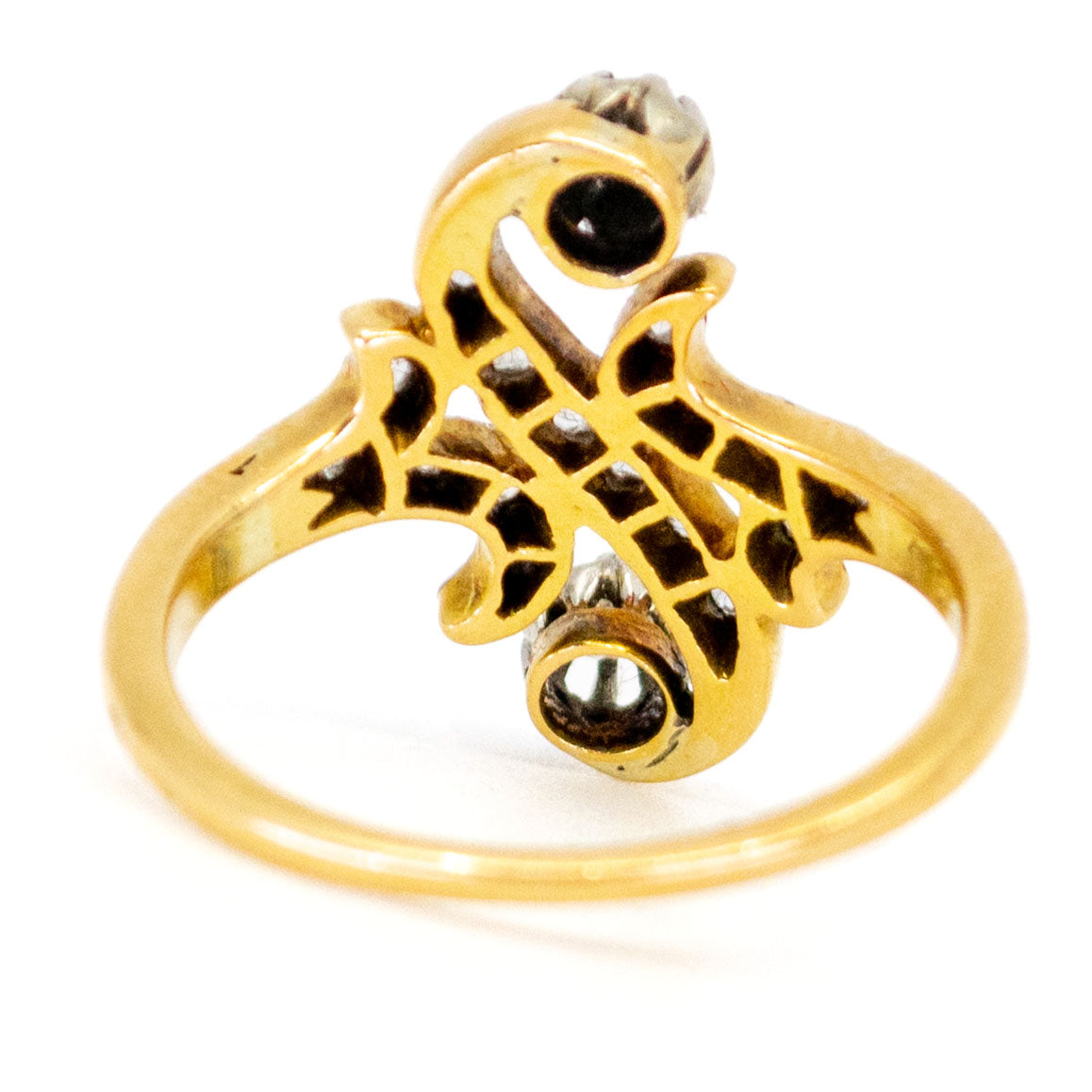 A yellow gold and platinum diamond fancy scroll design ring
