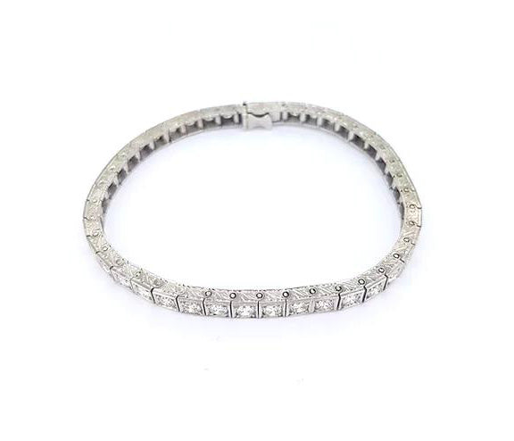 Vintage Ornately Engraved Diamond Line Bracelet, 4.50 carats, brilliant cut diamonds, four-claw set in square mounts with engraved sides, 18ct white gold