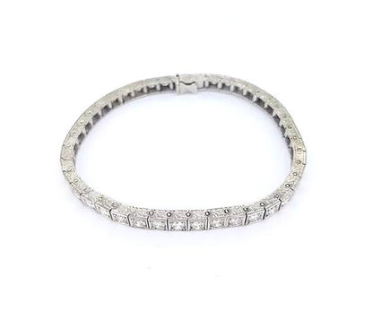 Vintage Ornately Engraved Diamond Line Bracelet, 4.50 carats, brilliant cut diamonds, four-claw set in square mounts with engraved sides, 18ct white gold