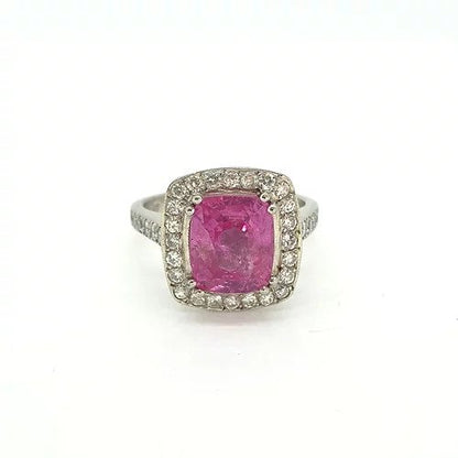 3.75ct Cushion Cut Pink Sapphire and Diamond Cluster Ring; central 3.75 carat cushion-cut pink sapphire surrounded by a square-shaped halo of diamonds with diamond set shoulders, in platinum