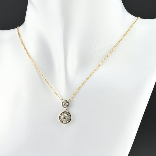 Art Deco 1.15ct Twin Old Cut Diamond Solitaire Target Pendant, 0.85ct old European-cut diamond topped with 0.30ct old mine-cut diamond in 18ct white gold target settings to fixed 18ct yellow gold trace chain