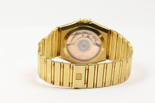 Omega Constellation 18ct Yellow Gold 35mm Chronometer Automatic, gold colour dial, date indicator, yellow gold fixed bezel, black Roman numerals, skeleton back, 18ct yellow gold bracelet with matching 18ct push-button clasp