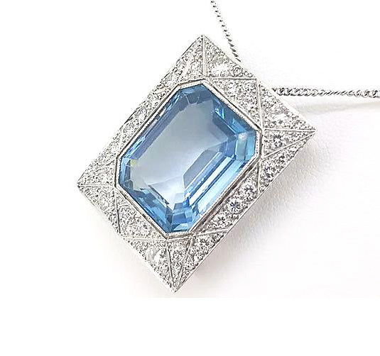 Art Deco Style Asscher Cut Aquamarine and Diamond Pendant; a striking octagonal step-cut aquamarine is surrounded by a diamond-set 18ct white gold mount.