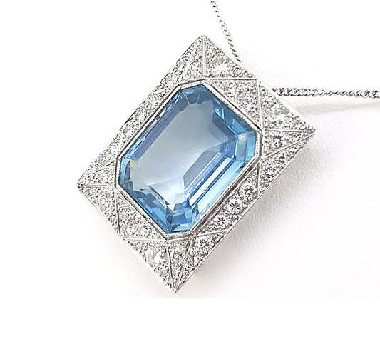 Art Deco Style Asscher Cut Aquamarine and Diamond Pendant; a striking octagonal step-cut aquamarine is surrounded by a diamond-set 18ct white gold mount.