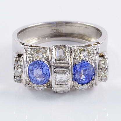 Art Deco 1.60ct Ceylon Sapphire and Old Cut Diamond Two Stone Tank Ring, two Ceylon sapphires with beautiful cornflower blue hue surrounded by old mine-cut diamonds with central raised section of square and rectangular step-cut diamonds in platinum. Circa 1925