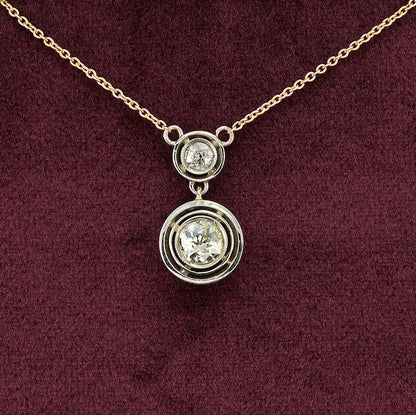 Art Deco 1.15ct Twin Old Cut Diamond Solitaire Target Pendant, 0.85ct old European-cut diamond topped with 0.30ct old mine-cut diamond in 18ct white gold target settings to fixed 18ct yellow gold trace chain
