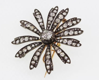 Antique Victorian 1.20ct Old Cut Diamond Daisy Flower Brooch; central 1.20 carat old-cut diamond, with diamond set petals, set in silver and backed with gold