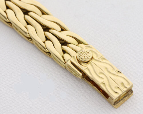 Patek Philippe La Flamme Ladies 18ct Yellow Gold 23mm Diamond Dial Quartz Watch, off-white/cream dial, four diamond hour markers, 18ct yellow gold bracelet with small fold-over clasp