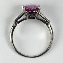 Pink Sapphire, Diamond and Platinum Solitaire Ring; set with a 1.45ct round faceted pink sapphire, with single-cut diamond set shoulders