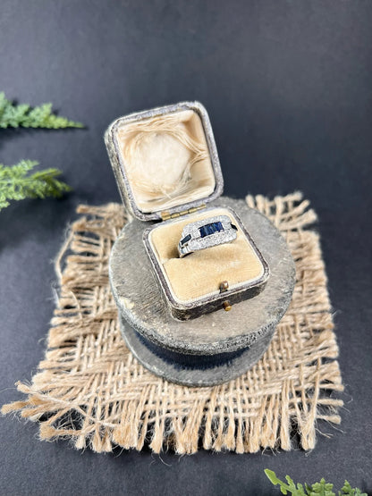 A sapphire and diamond cocktail ring in platinum, in an antique ring box