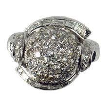 Vintage Diamond and Platinum Domed Cocktail Ring; central dome encrusted with brilliant diamonds, with a curve of tapered baguette diamonds and diamond set shoulders, 3.72 carat total. Numbered 995644