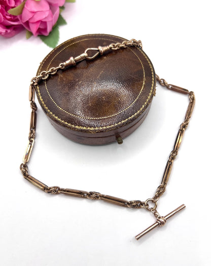 A rose gold fancy link Albert chain necklace