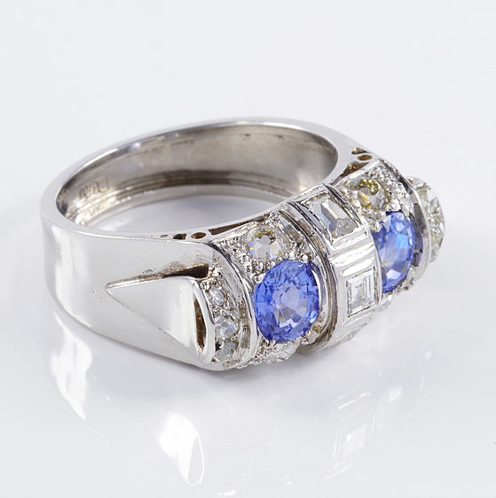 Art Deco 1.60ct Ceylon Sapphire and Old Cut Diamond Two Stone Tank Ring, two Ceylon sapphires with beautiful cornflower blue hue surrounded by old mine-cut diamonds with central raised section of square and rectangular step-cut diamonds in platinum. Circa 1925