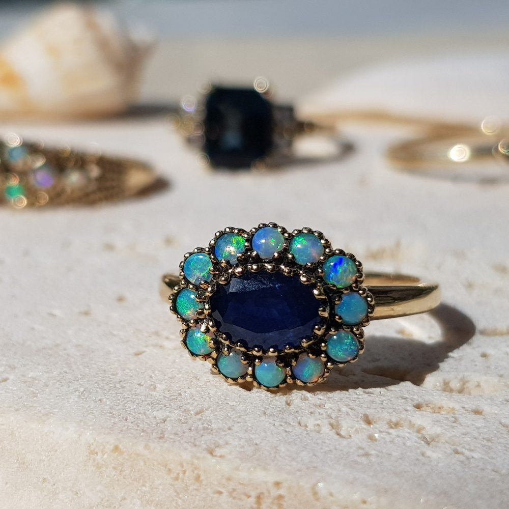 0.90ct Oval Sapphire and Opal Flower Cluster Ring