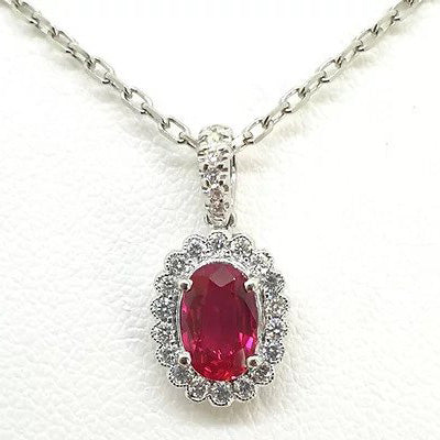 0.69ct Oval Ruby and Diamond Cluster Pendant and Chain