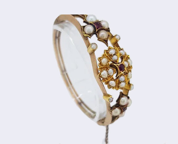 Antique Edwardian Pearl and Ruby Bangle, in 15ct yellow gold.