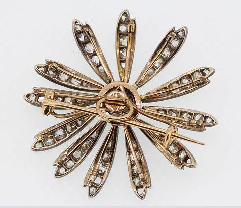 Antique Victorian 1.20ct Old Cut Diamond Daisy Flower Brooch; central 1.20 carat old-cut diamond, with diamond set petals, set in silver and backed with gold