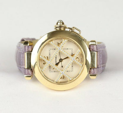 Cartier Pasha de Cartier 18ct Yellow Gold 2399 Ladies Automatic 32mm Wrist Watch With Removable Diamond Grill, white textured dial, Arabic numerals at 12, 3, 6 and 9 o'clock, sapphire crystal glass and a pavé set diamond crown cap. On a Cartier purple leather strap, with a Cartier 18ct yellow gold pin buckle.