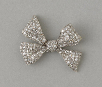 Art Deco Old Cut Diamond Bow Brooch in Platinum; fully set with 4.50 carats of old single cut diamonds. Circa 1920, France
