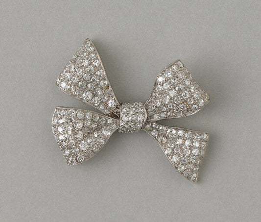 Art Deco Old Cut Diamond Bow Brooch in Platinum; fully set with 4.50 carats of old single cut diamonds. Circa 1920, France