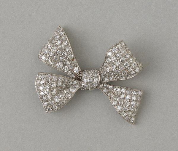 Art Deco Old Cut Diamond Bow Brooch in Platinum; fully set with 4.50 carats of old single cut diamonds. Circa 1920, France