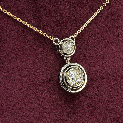 Art Deco 1.15ct Twin Old Cut Diamond Solitaire Target Pendant, 0.85ct old European-cut diamond topped with 0.30ct old mine-cut diamond in 18ct white gold target settings to fixed 18ct yellow gold trace chain