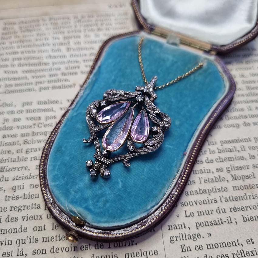 Antique Pink Topaz and Diamond Pendant Necklace, three teardrop pear shaped pink topaz within rose-cut diamond set surround in silver upon 18ct gold