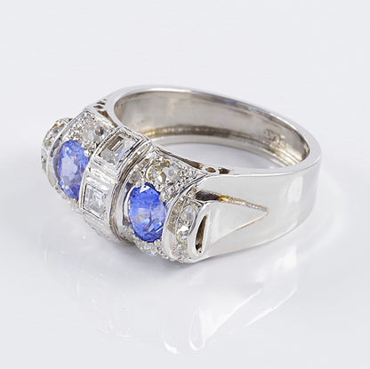 Art Deco 1.60ct Ceylon Sapphire and Old Cut Diamond Two Stone Tank Ring, two Ceylon sapphires with beautiful cornflower blue hue surrounded by old mine-cut diamonds with central raised section of square and rectangular step-cut diamonds in platinum. Circa 1925