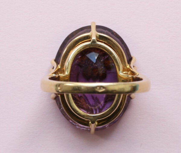 Antique Edwardian Oval Amethyst and Rose Cut Diamond Flower Ring; large oval facetted amethyst encrusted with rose cut diamonds, 18ct yellow gold