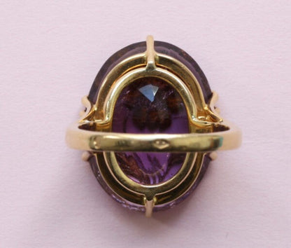 Antique Edwardian Oval Amethyst and Rose Cut Diamond Flower Ring; large oval facetted amethyst encrusted with rose cut diamonds, 18ct yellow gold