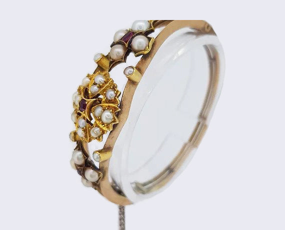 Antique Edwardian Pearl and Ruby Bangle, in 15ct yellow gold.