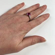Pink Sapphire, Diamond and Platinum Solitaire Ring; set with a 1.45ct round faceted pink sapphire, with single-cut diamond set shoulders