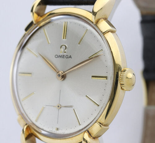 Omega Vintage Gents 18ct Yellow Gold 35mm Manual Watch, silver dial, teardrop lugs, smalls seconds sub-dial, acrylic crystal, on a black leather strap with Omega buckle, Circa 1950s