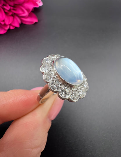 Antique French Platinum Cabochon Moonstone and Diamond Cluster Ring, Circa 1920
