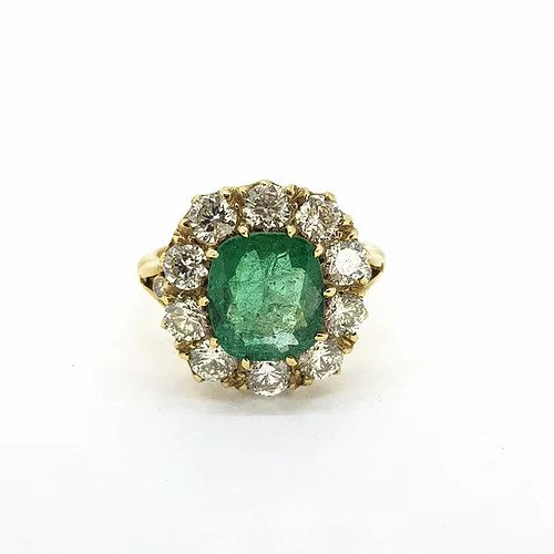Victorian Style Emerald and Old Cut Diamond Cluster Ring; featuring a central 2.50ct cushion cut emerald surrounded by 2.00cts old-cut diamonds, in 18ct yellow gold