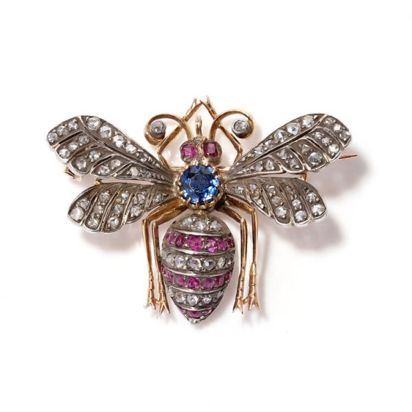 Antique Victorian Rose Cut Diamond, Ruby and Sapphire Insect Brooch; 19th century insect brooch with central 0.45ct blue sapphire accented with 1.48cts rose cut diamonds and 0.76cts rubies to the body, wings, eyes and antennae, in silver-upon-gold, Circa 1870s