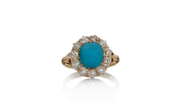 Antique Victorian Turquoise and Old Cut Diamond Cluster Ring; central 2.50ct round cabochon cut turquoise surrounded by 1.65cts old cut diamonds, in 15ct yellow gold, Circa 1870s