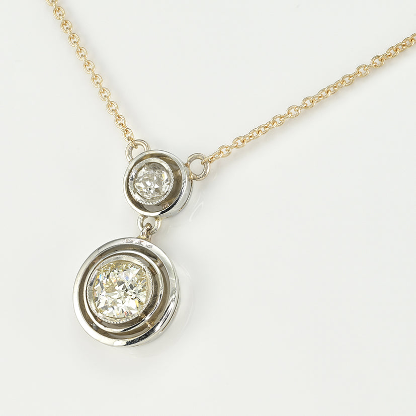 Art Deco 1.15ct Twin Old Cut Diamond Solitaire Target Pendant, 0.85ct old European-cut diamond topped with 0.30ct old mine-cut diamond in 18ct white gold target settings to fixed 18ct yellow gold trace chain