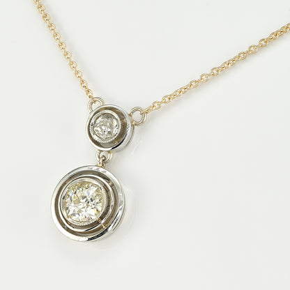 Art Deco 1.15ct Twin Old Cut Diamond Solitaire Target Pendant, 0.85ct old European-cut diamond topped with 0.30ct old mine-cut diamond in 18ct white gold target settings to fixed 18ct yellow gold trace chain