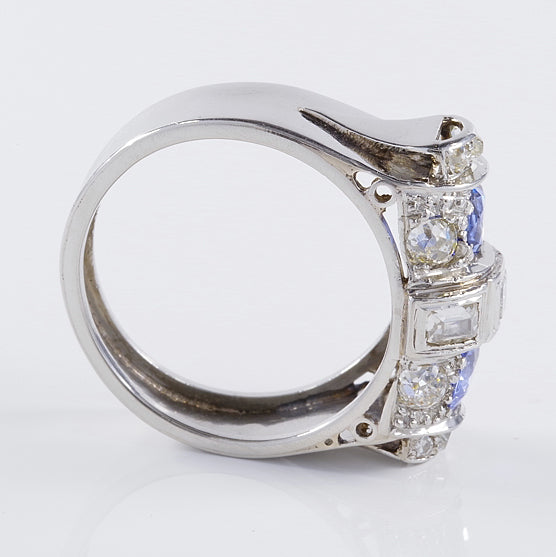 Art Deco 1.60ct Ceylon Sapphire and Old Cut Diamond Two Stone Tank Ring, two Ceylon sapphires with beautiful cornflower blue hue surrounded by old mine-cut diamonds with central raised section of square and rectangular step-cut diamonds in platinum. Circa 1925