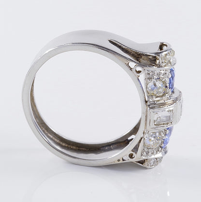 Art Deco 1.60ct Ceylon Sapphire and Old Cut Diamond Two Stone Tank Ring, two Ceylon sapphires with beautiful cornflower blue hue surrounded by old mine-cut diamonds with central raised section of square and rectangular step-cut diamonds in platinum. Circa 1925