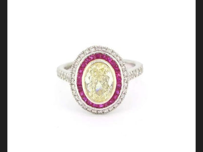 Fancy Yellow Diamond and Ruby Calibre Set Ring, 1.51 carats, certified