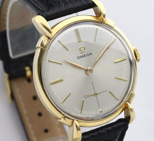 Omega Vintage Gents 18ct Yellow Gold 35mm Manual Watch, silver dial, teardrop lugs, smalls seconds sub-dial, acrylic crystal, on a black leather strap with Omega buckle, Circa 1950s