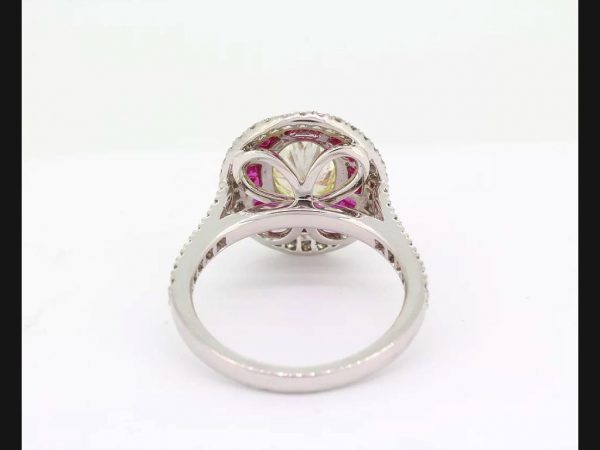 Oval cut Fancy Yellow Diamond and Ruby Calibre Set Ring, certified